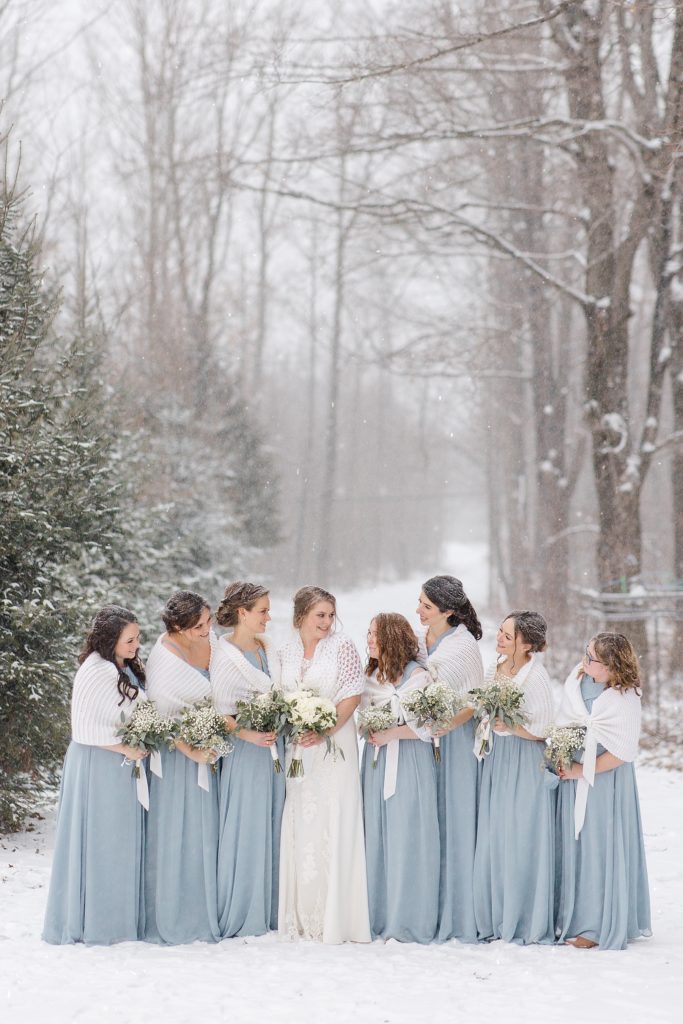 wedding party wearing navy and dusty blue for temples country winter wedding photographed by Brittany Navin Photography