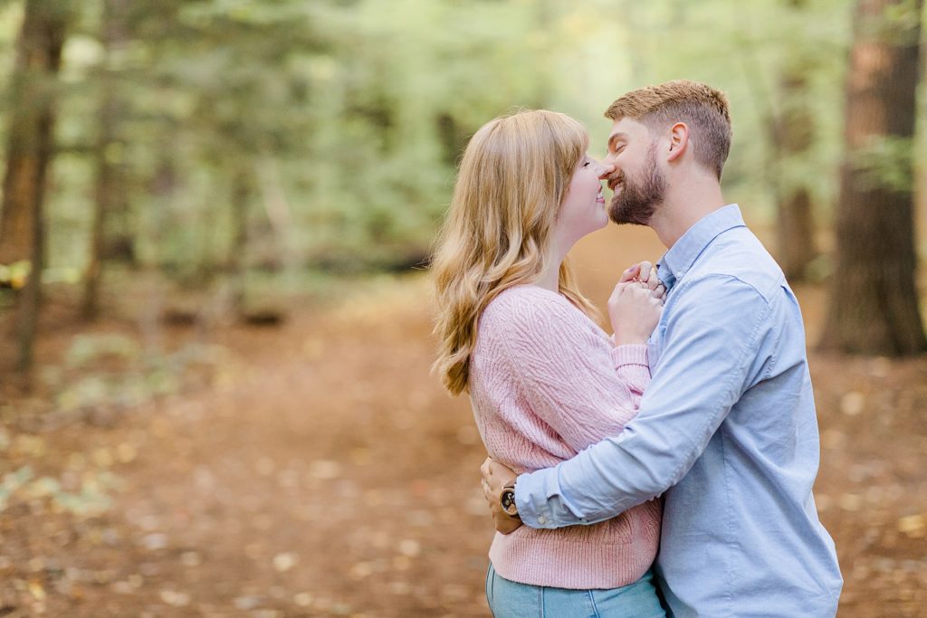 couple about to kiss at Arnprior engagement session at Gillies Grove photographed by Brittany Navin Photography