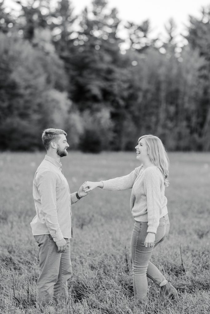 couple dancing in open field at Arnprior engagement session at Gillies Grove photographed by Brittany Navin Photography