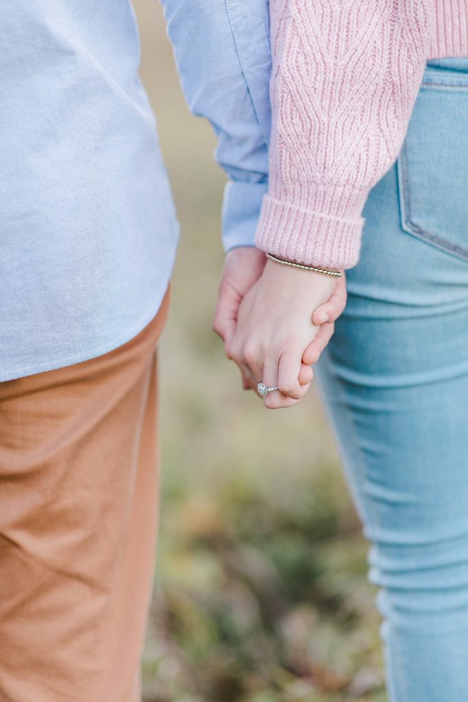 close up of couple holding hands at Arnprior engagement session at Gillies Grove photographed by Brittany Navin Photography