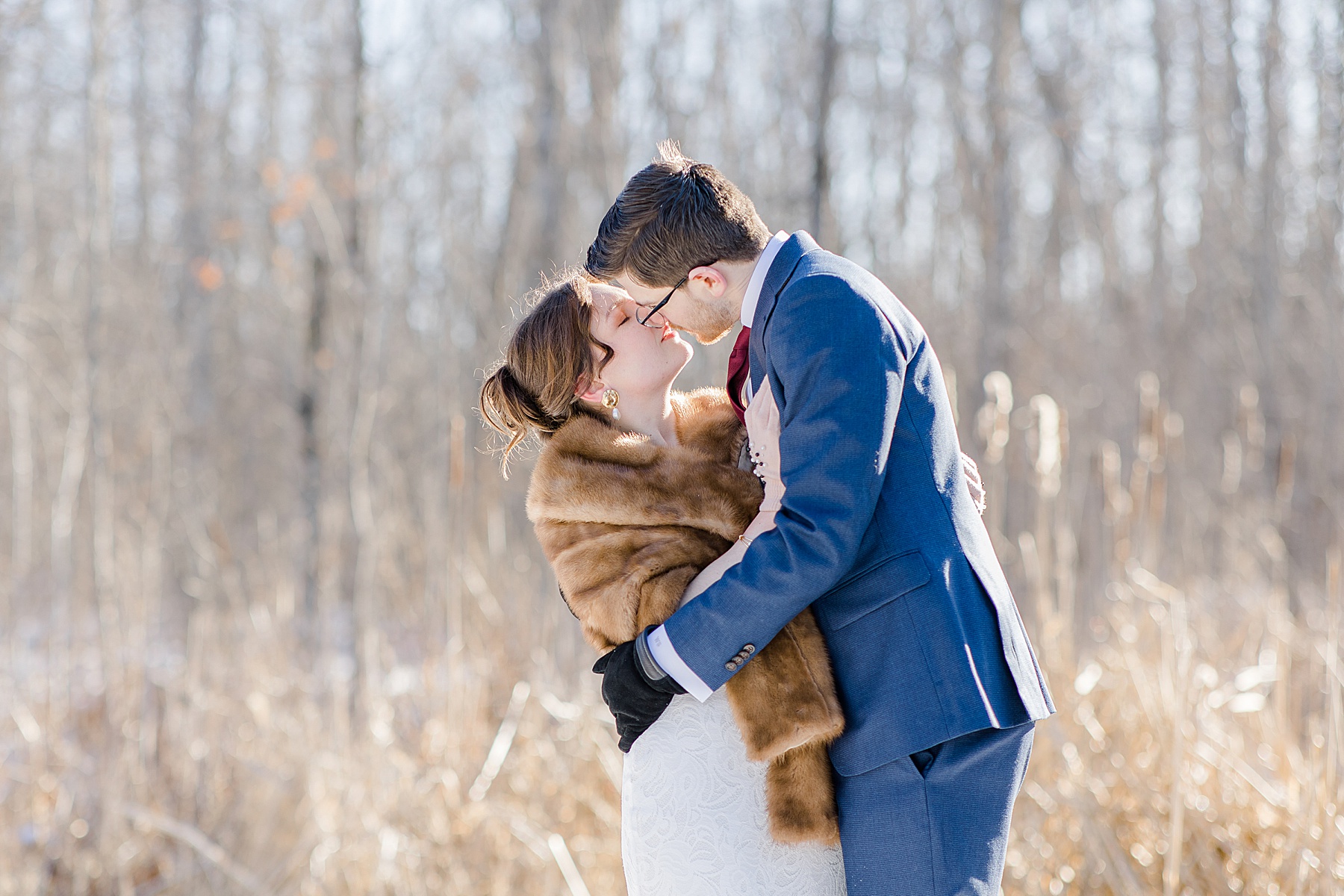 bride and groom about to kiss during their portraits at Beckwith winter elopement photographed by Brittany Navin Photography
