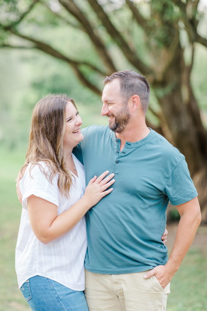 couple looking at eachother at dominion arboretum engagement session phtoographed by Brittany Navin Photography
