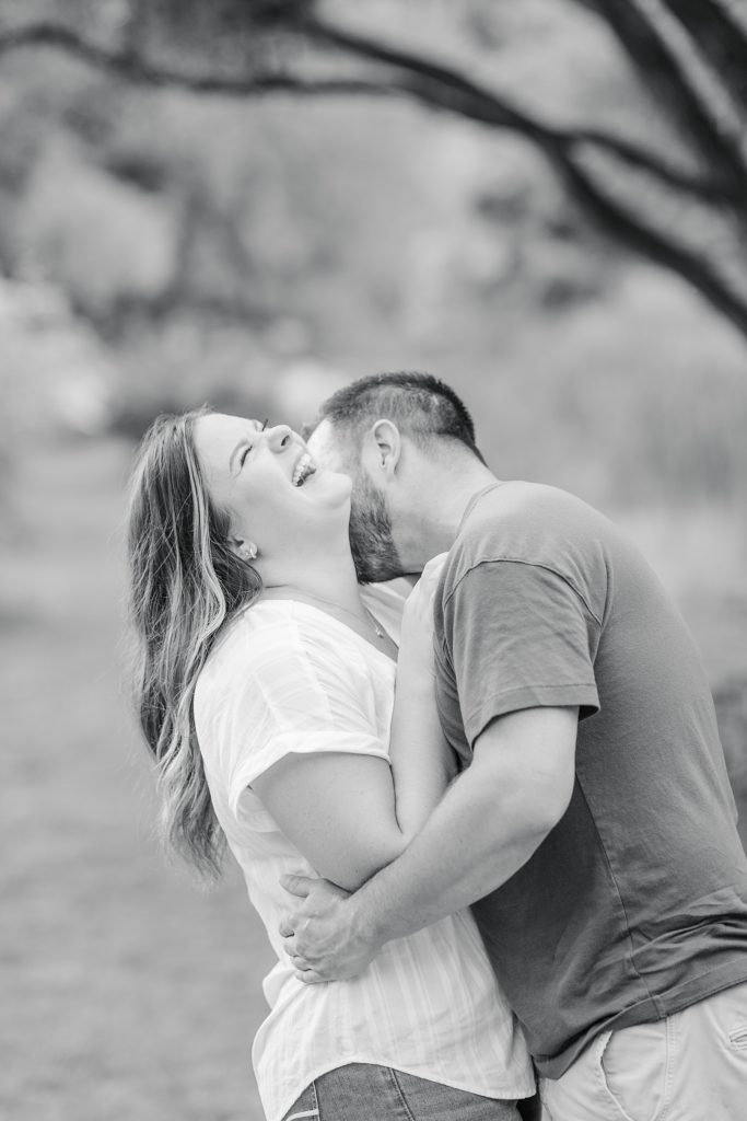 couple laughing together at dominion arboretum engagement session phtoographed by Brittany Navin Photography