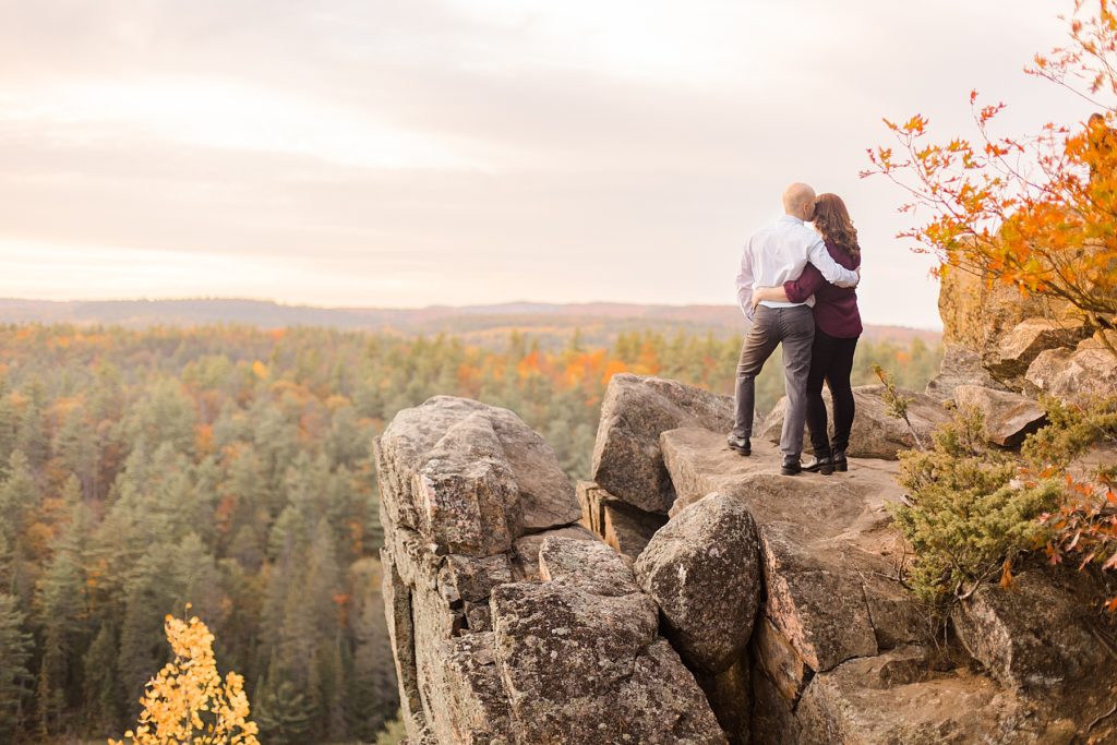 couple enjoying the sunset at eagle's nest fall engagement photographed by Brittany Navin Photography