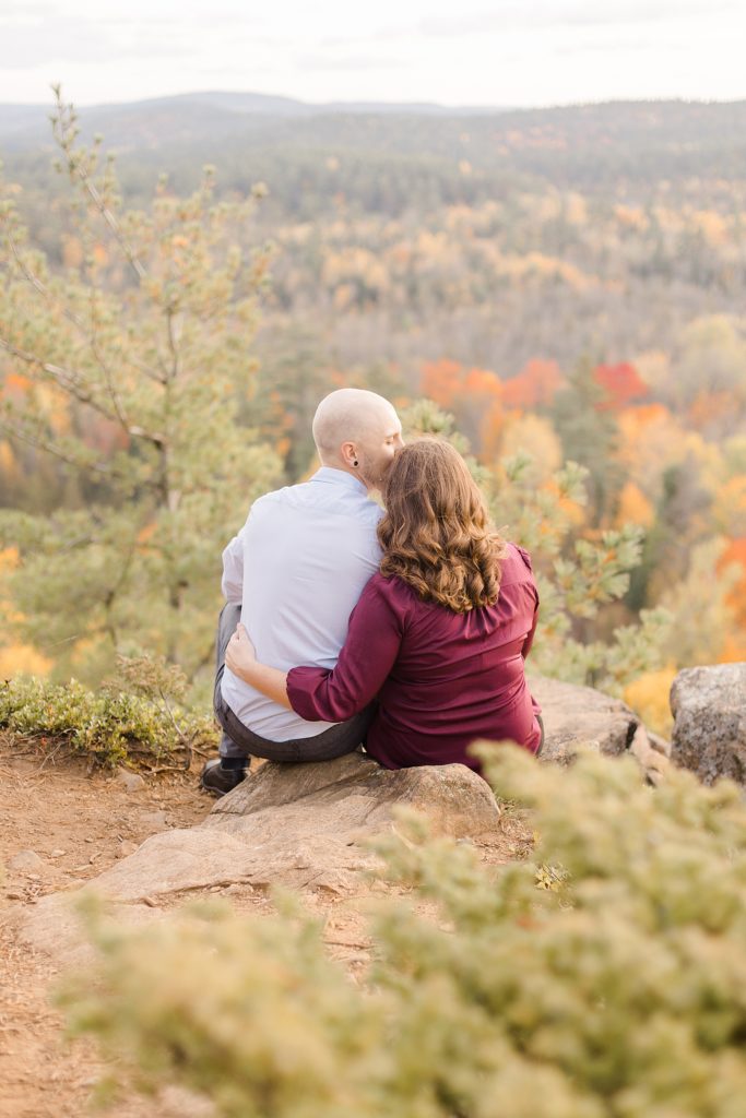 couple enjoying the view of fall foliage at eagle's nest fall engagement photographed by Brittany Navin Photography