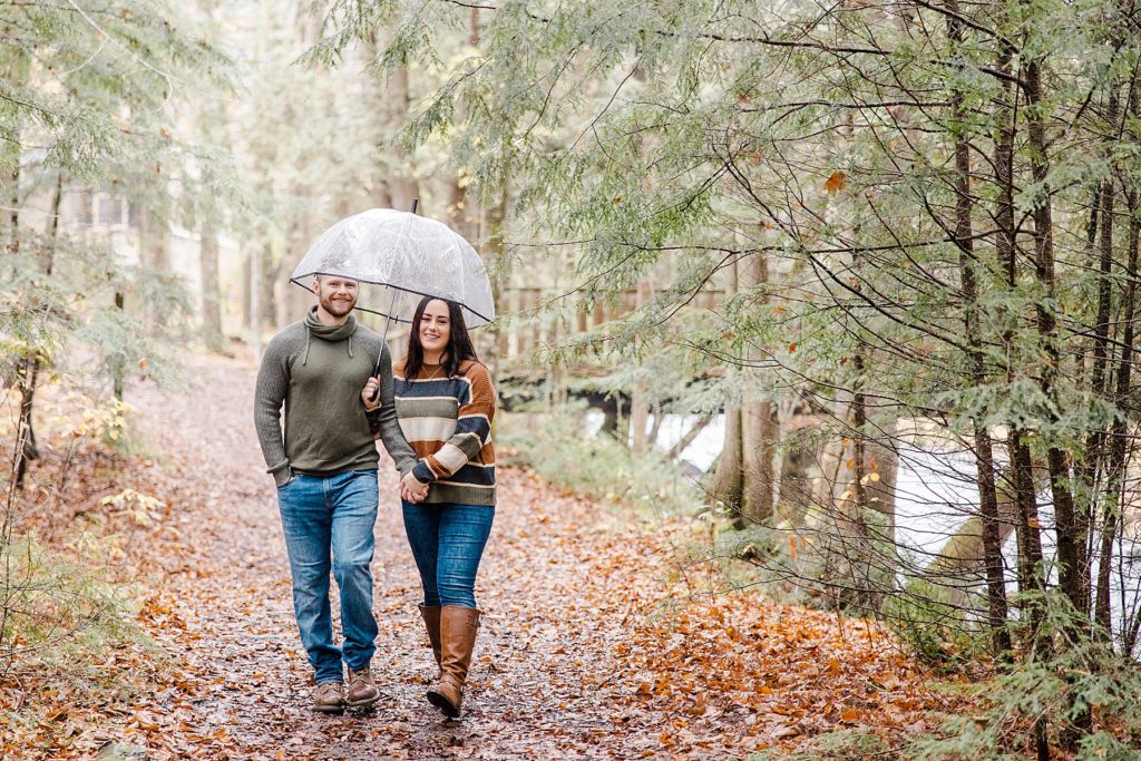 rainy autumn engagement session  at the mill of kintail in mississippi mills photographed by Brittany Navin Photography