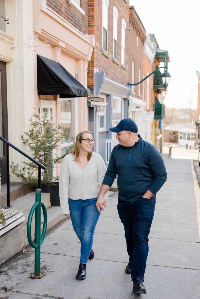 couple walking at Downtown Almonte Engagement Session photographed by Brittany Navin Photography