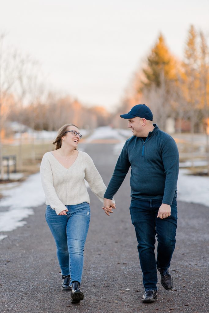 walking through a trail at Downtown Almonte Engagement Session photographed by Brittany Navin Photography