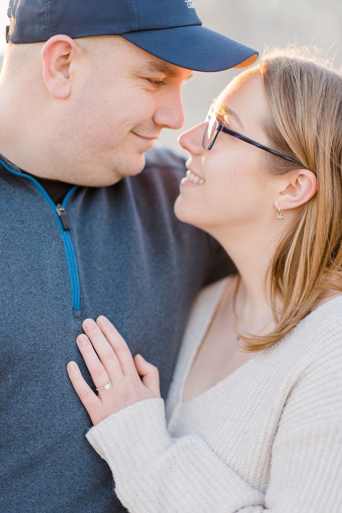 close up of her hand on his chest at Downtown Almonte Engagement Session photographed by Brittany Navin Photography