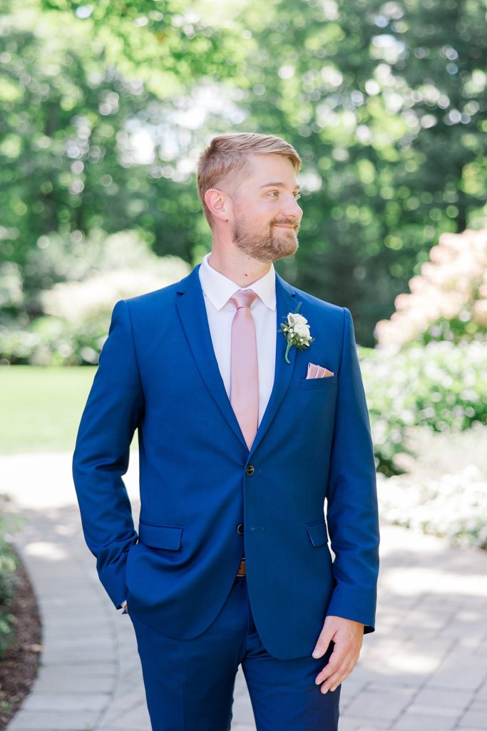Groom Portraits in garden of Temple's Country Wedding photographed by Brittany Navin Photography 