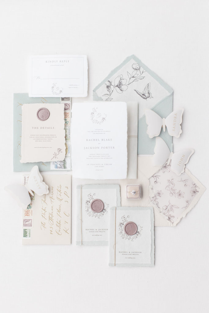 Wedding invitation heirloom suite by Letterland Studio photographed in a flat lay