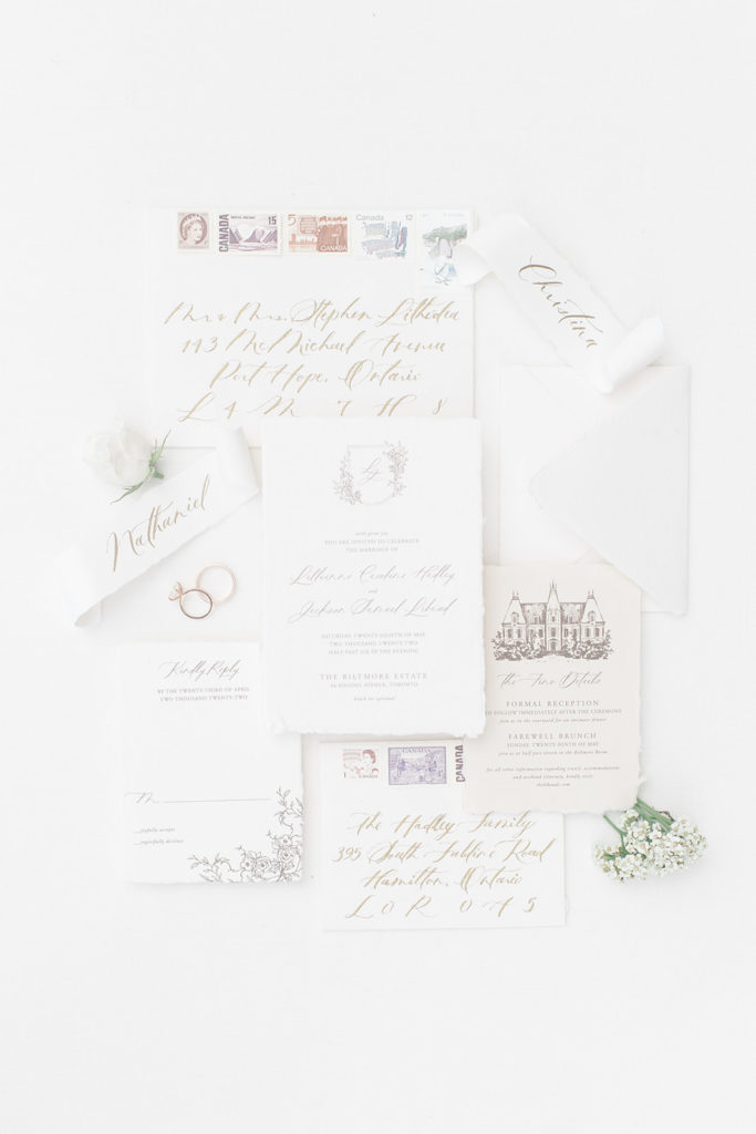Wedding invitation heirloom suite by Letterland Studio photographed in a flat lay