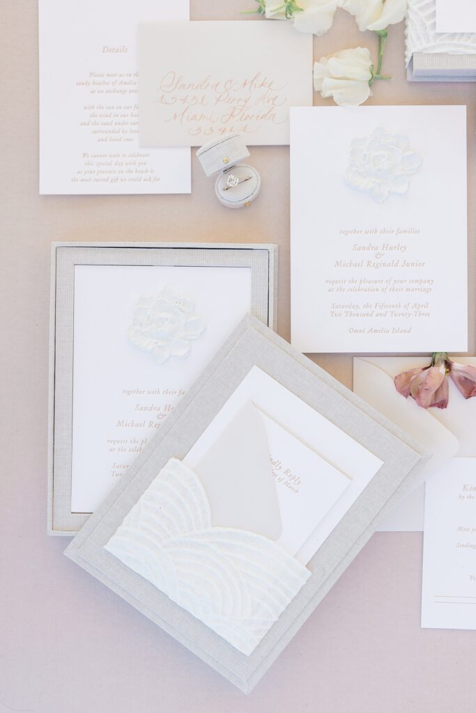 Wedding invitation heirloom suite photographed in a flat lay