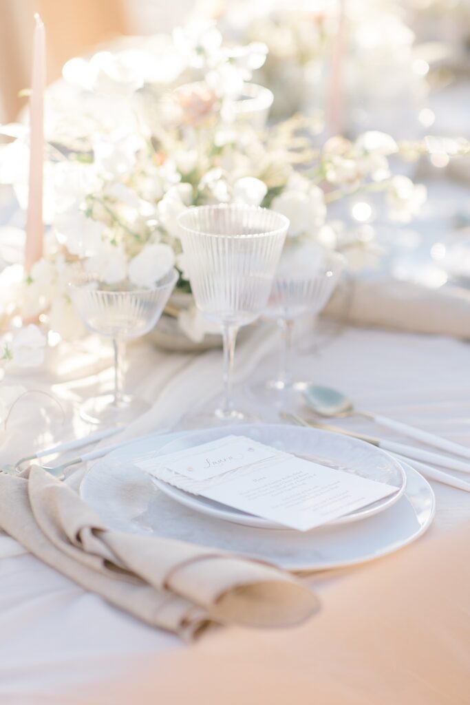 light and neutral wedding table scape at the coastal opulence beach wedding editorial photographed by Brittany Navin Photography