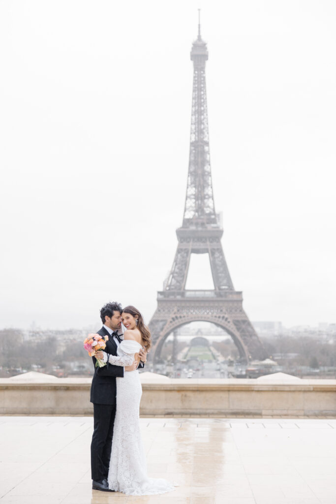bride and groom wedding portraits at Eiffel Tower during elopement editorial in Paris, France, photographed by Brittany Navin Photography, an Ottawa based destination wedding photographer.