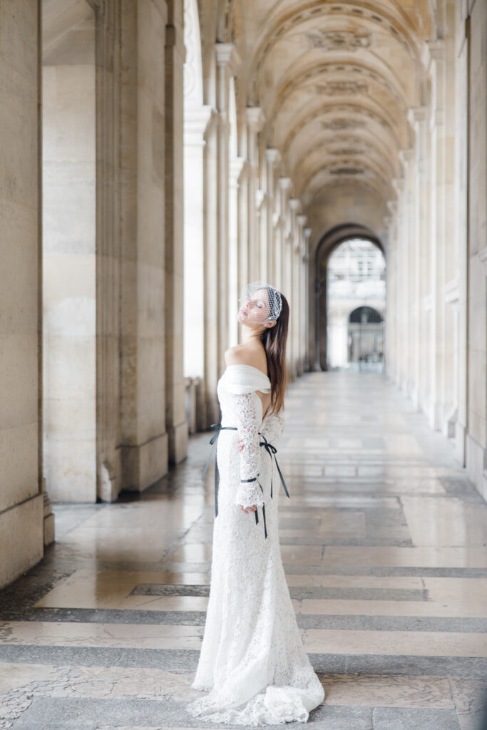 bridal portrait in the louvre during elopement editorial in Paris photographed by destination wedding photographer Brittany Navin Photography