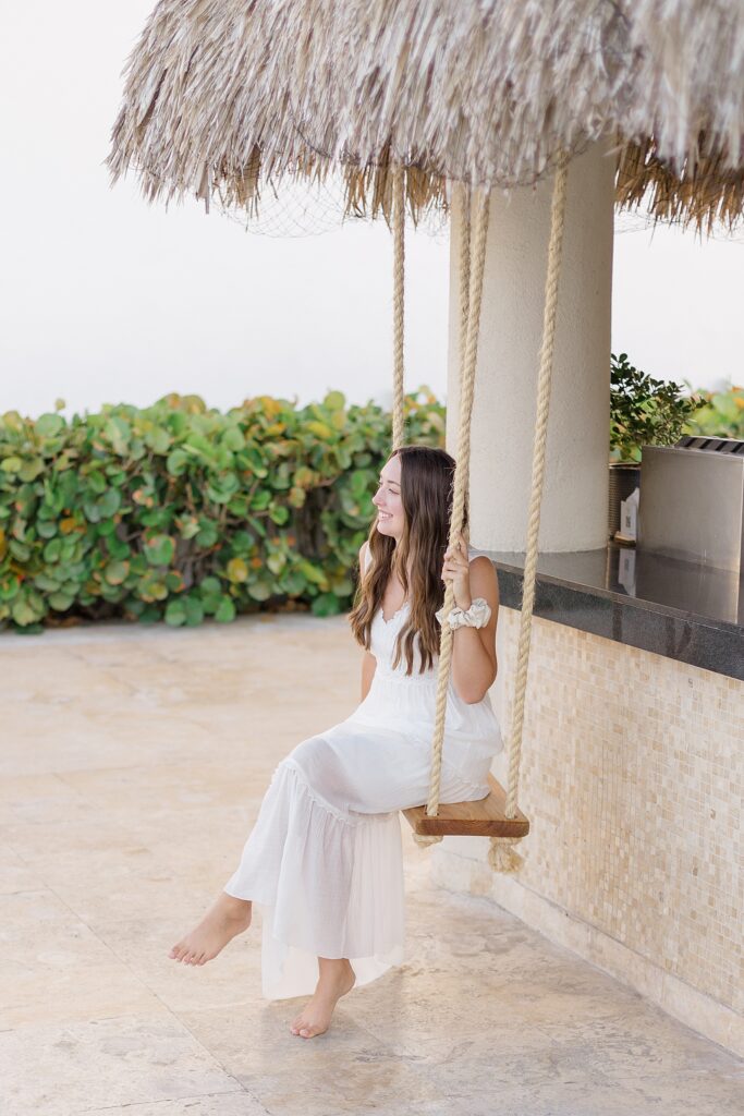 Swinging on tiki swing at Dreams Dominicus La Romana Resort in Punta Cana, Dominican Republic photographed by Brittany Navin Photography