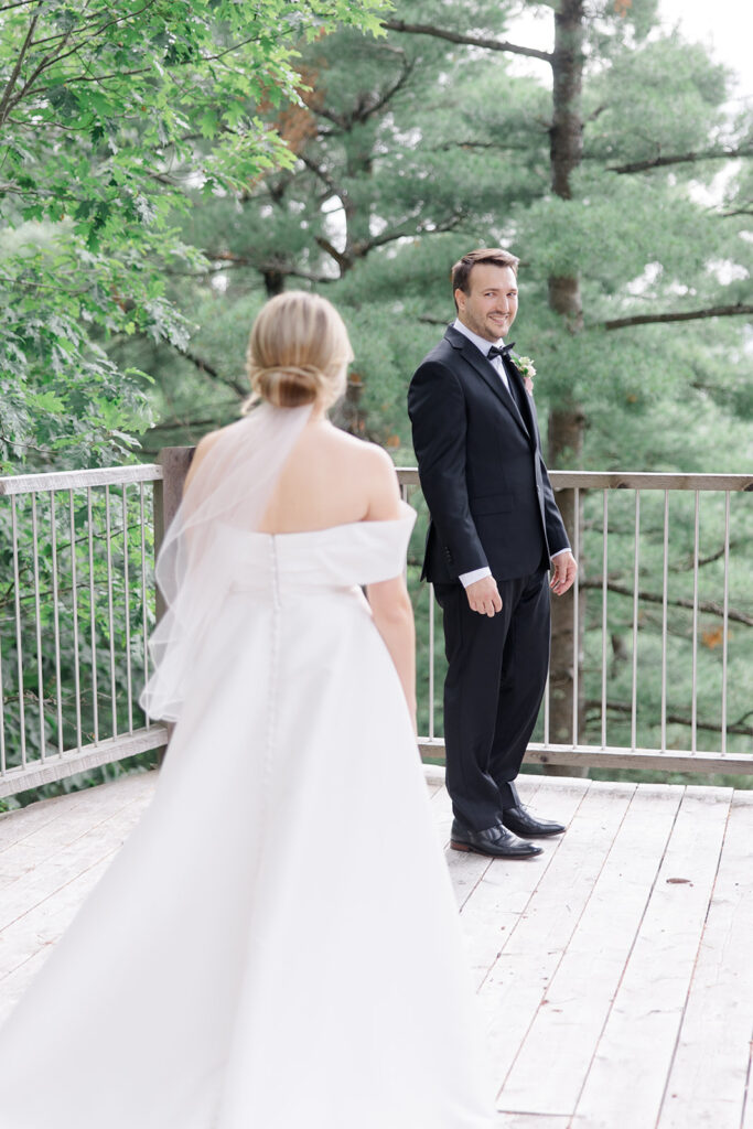 bride and groom share first look at Le Belvedere Wedding photographed by Brittany Navin Photography, an Ottawa based Destination wedding photographer