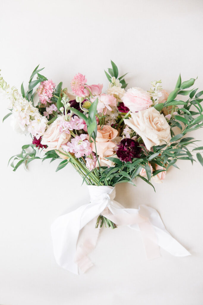 blush pink with hint of burgandy bridal bouquet by Wild Bloem Studios photographed by Brittany Navin Photography