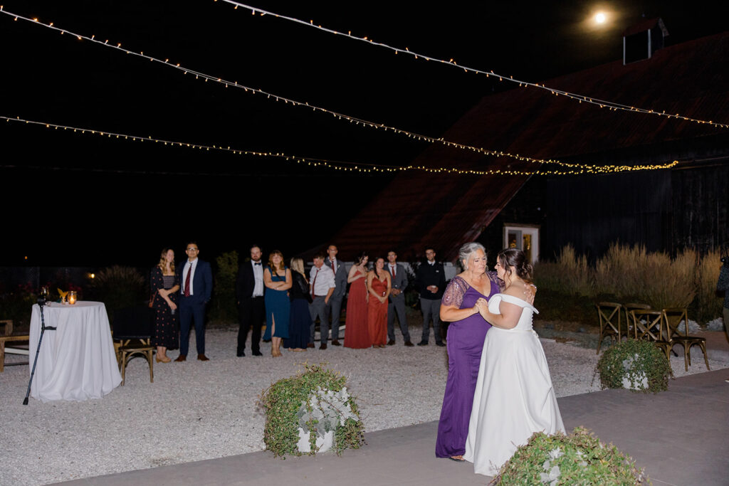 mother-daughter wedding dance under the moon and twinkle lights at Bleeks and Bergamot wedding in Ashton, Ontario photographed by Ottawa wedding photographer, Brittany Navin Photography