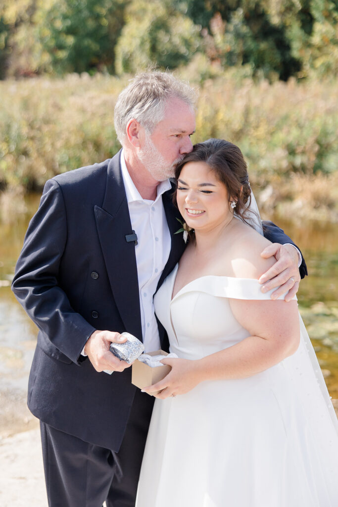 sweet moment between bride and father after a father-daughter first look at Bleeks and Bergamot wedding in Ashton, Ontario photographed by Ottawa wedding photographer, Brittany Navin Photography