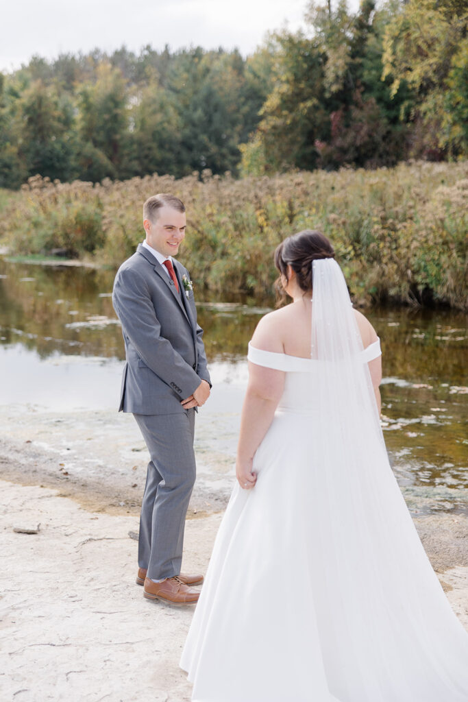 groom sees his bride for the first time at Bleeks and Bergamot wedding in Ashton, Ontario photographed by Ottawa wedding photographer, Brittany Navin Photography