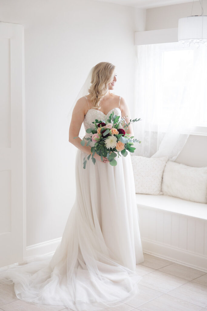 Bridal portrait in the bridal suite at Stonefields Estate wedding photographed by Ottawa Wedding Photographer Brittany Navin Photography
