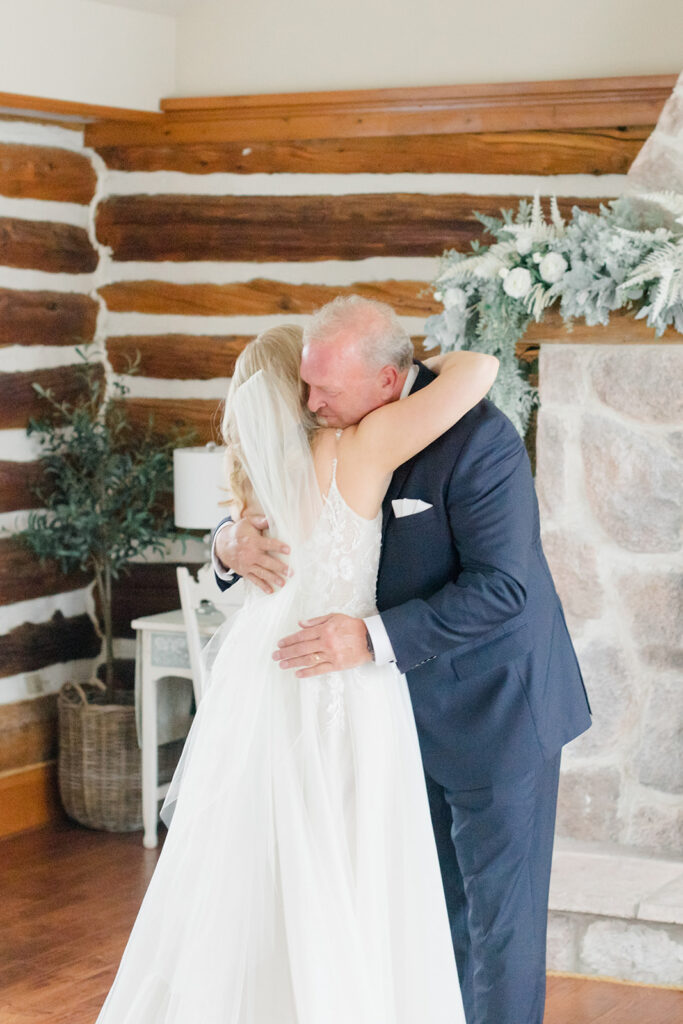 bride and her father share sweet moment after father-daughter first look photographed by Brittany Navin Photography