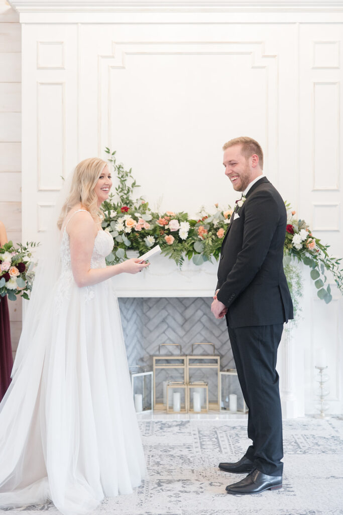 bride and groom laughing during their personal vows at Stonefields Estate wedding photographed by Ottawa Wedding Photographer Brittany Navin Photography