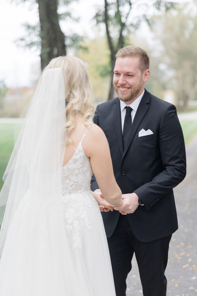 grooms reaction to seeing his bride for the first time at Stonefields Estate wedding photographed by Ottawa Wedding Photographer Brittany Navin Photography