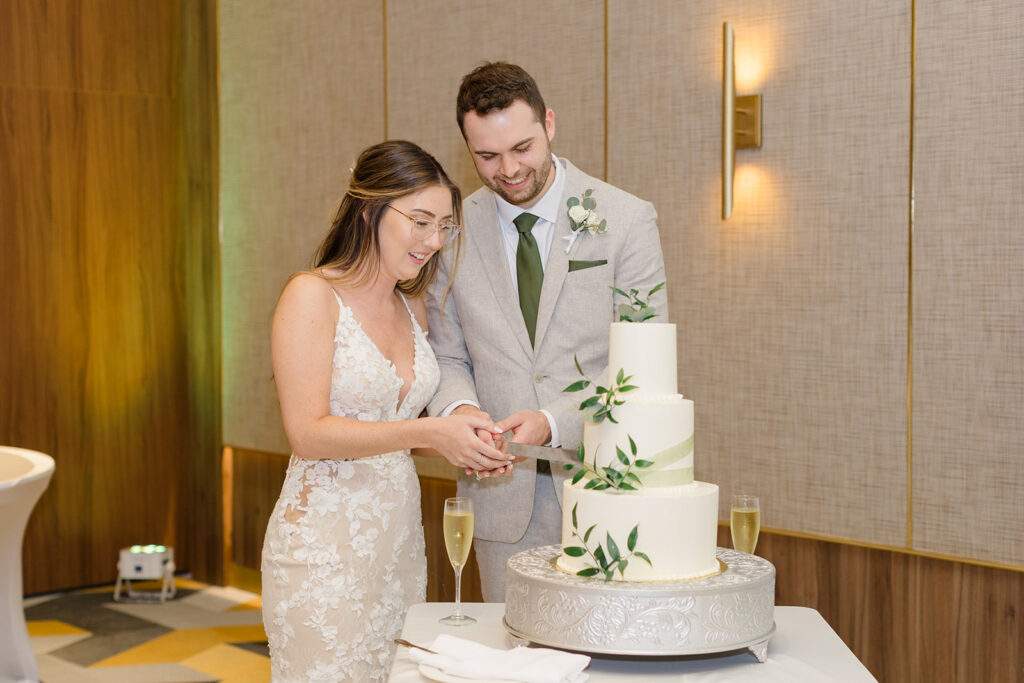 bride and groom cutting cake at destination wedding photographed by Ottawa wedding photographer, Brittany Navin