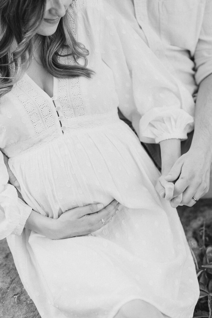 close up of baby bump at dominion arboretum maternity session in Ottawa photographed by Brittany Navin