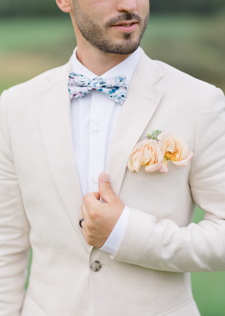 grooms peach pocket boutonnierre at Le Peaches and Cream Wedding photographed by Ottawa wedding photographer, Brittany Navin